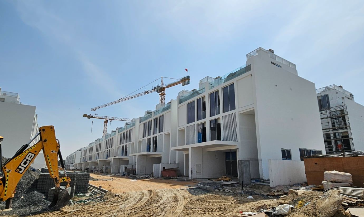 IXORA villas under construction with tower cranes